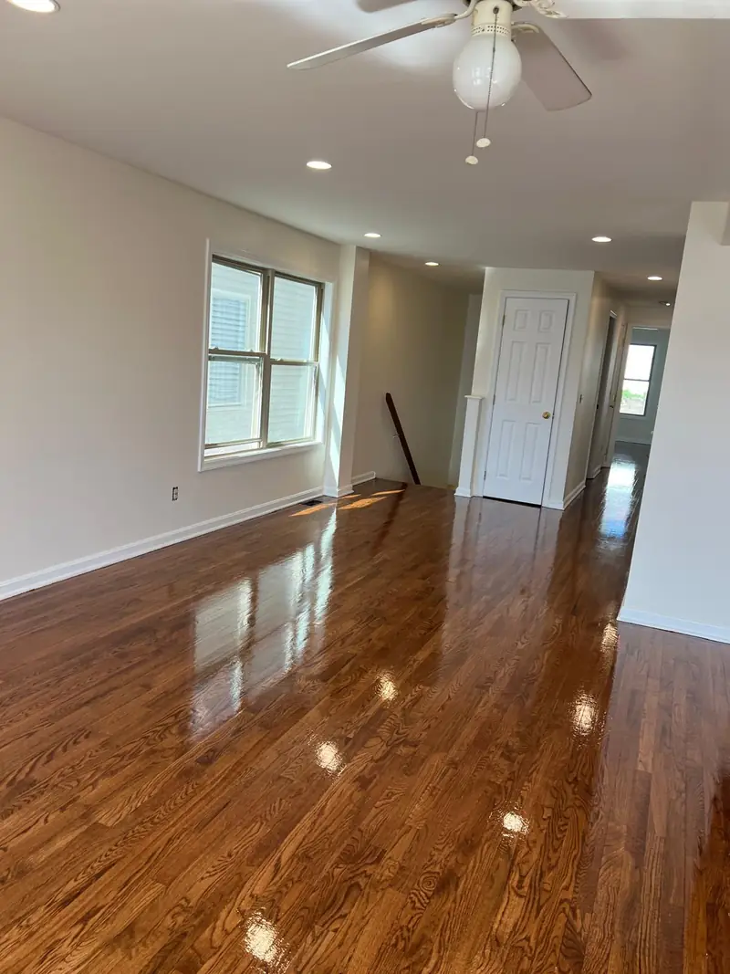 Bright room with freshly sanded and refinished hardwood floor in a gloss finish