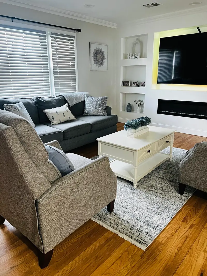 Furnished living room with stained hardwood floors
